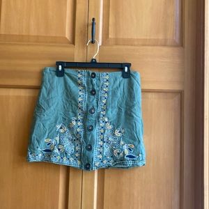 Cute green mini skirt with yellow and blue embroidery